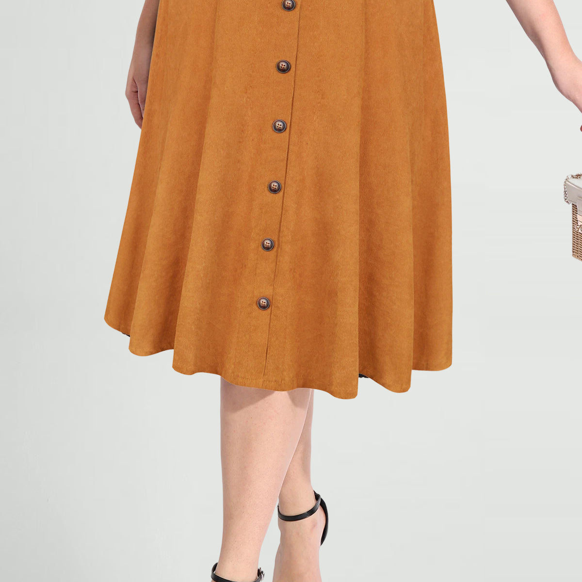 Jupe mi-longue à taille haute avec fermeture éclair et détails à boutons unis