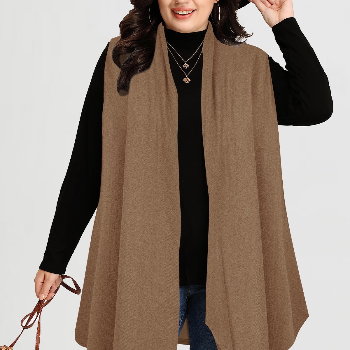 Langer ärmelloser Mantel mit Karomuster und Streifen